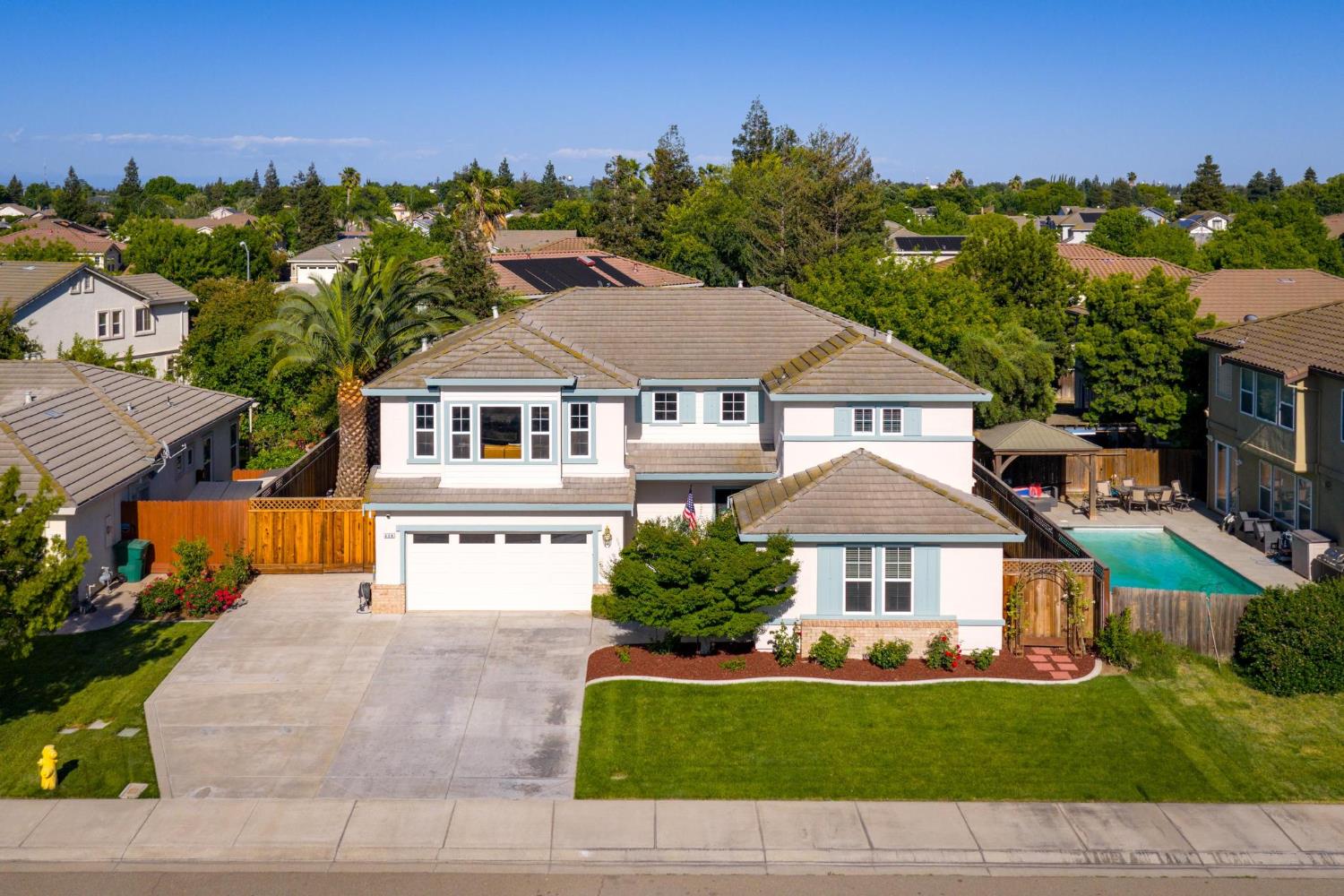 426 South Highland Avenue Ripon, CA 95366 - Photo 4 of 82 a front view of a house with a garden
