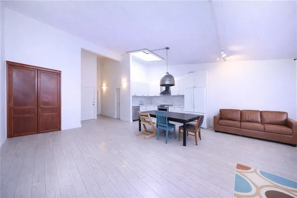 a view of a livingroom with furniture and wooden floor