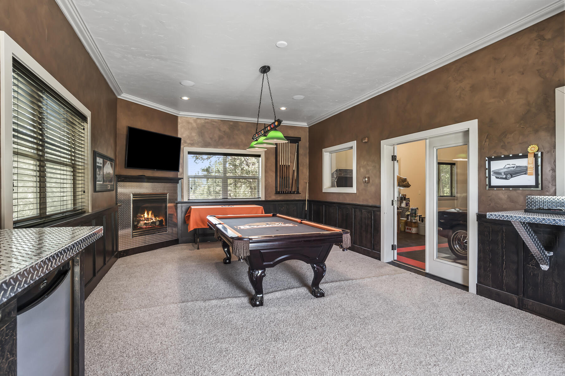 61445 Gosney Road Bend, OR 97702 - Photo 21 of 83 a room with pool table flat screen tv and window