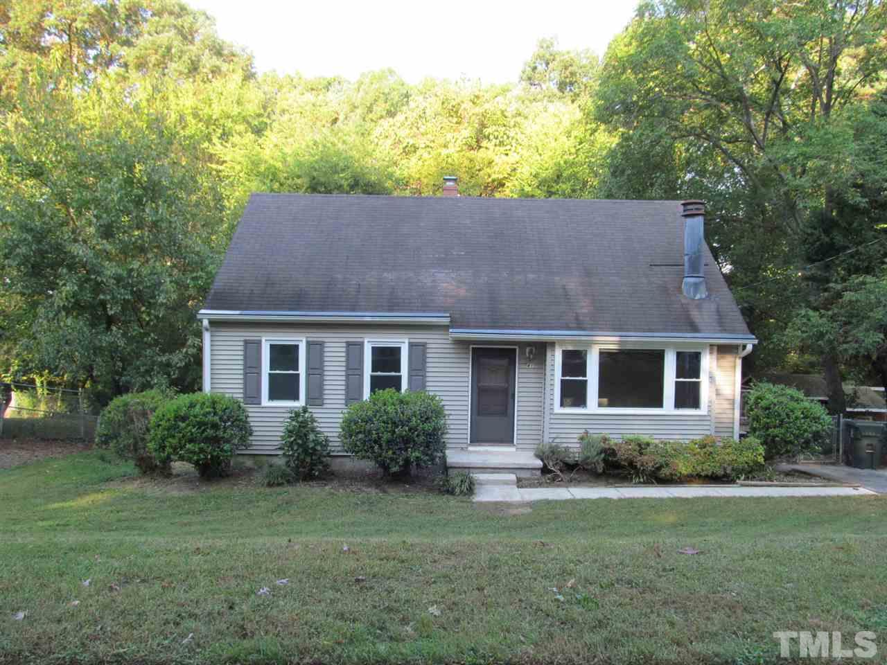 3417 Cheyenne Road Raleigh, NC 27609 - Photo 1 of 25 a front view of a house with a yard and trees