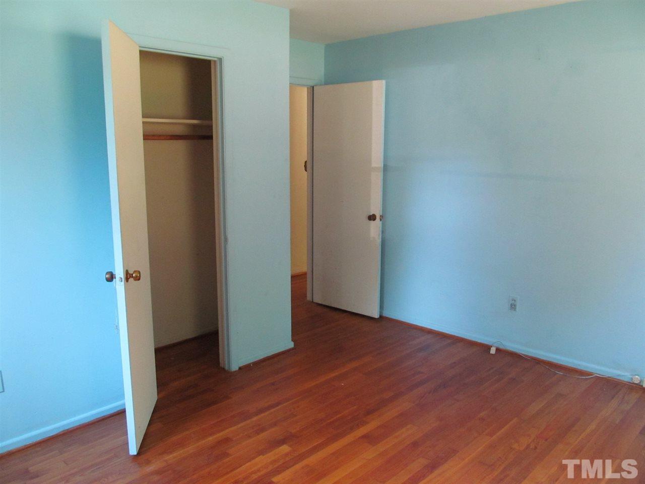 3417 Cheyenne Road Raleigh, NC 27609 - Photo 11 of 25 an empty room with wooden floor and entrance