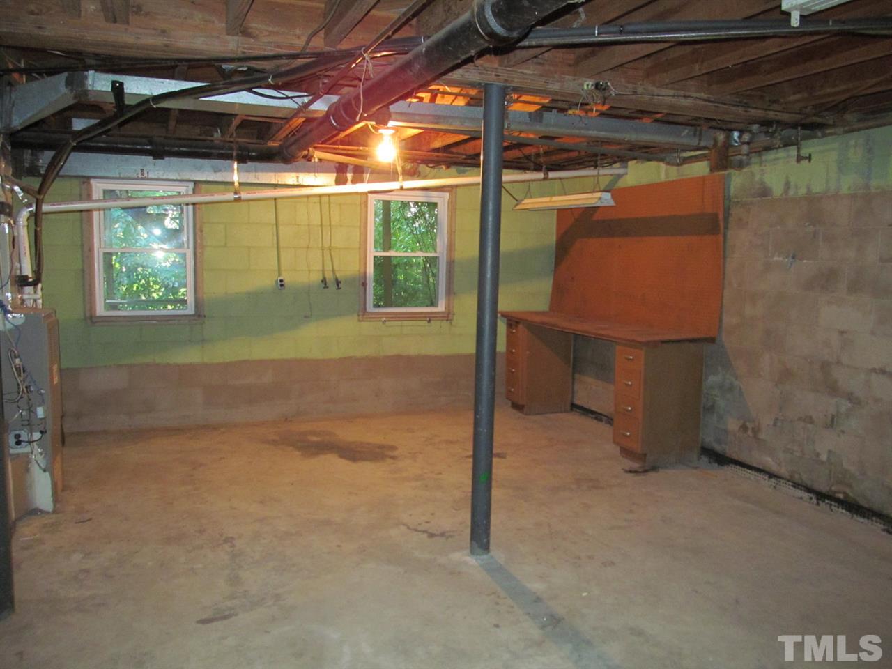 3417 Cheyenne Road Raleigh, NC 27609 - Photo 22 of 25 a view of a room with wooden walls