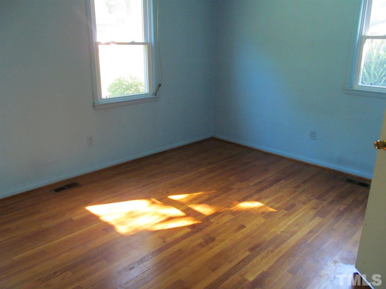 3417 Cheyenne Road Raleigh, NC 27609 - Photo 10 of 25 a view of empty room with wooden floor and fan