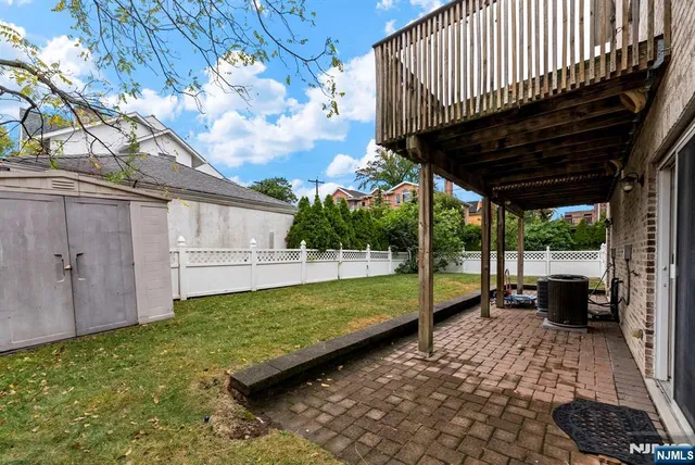 a view of a backyard with sitting area