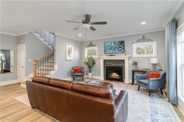 a living room with furniture and a fireplace