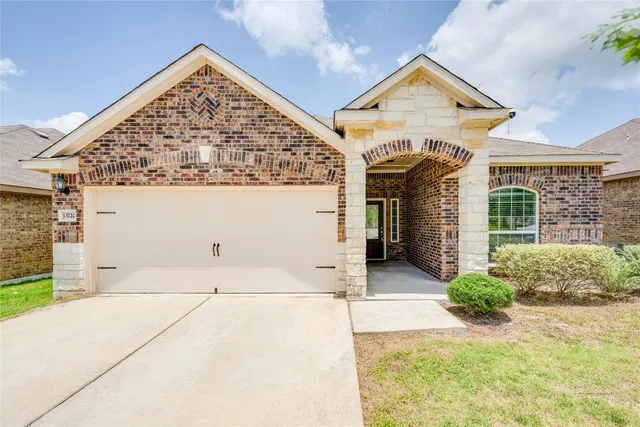 front view of a house with a large window
