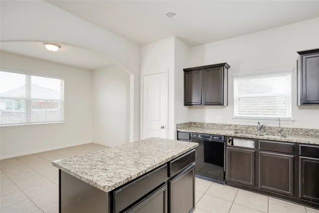 a kitchen with a stove and a sink