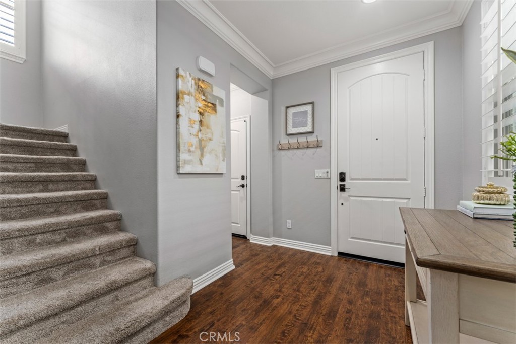 23 Vivido Street Rancho Mission Viejo, CA 92694 - Photo 13 of 44 a view of a hallway with wooden floor and staircase
