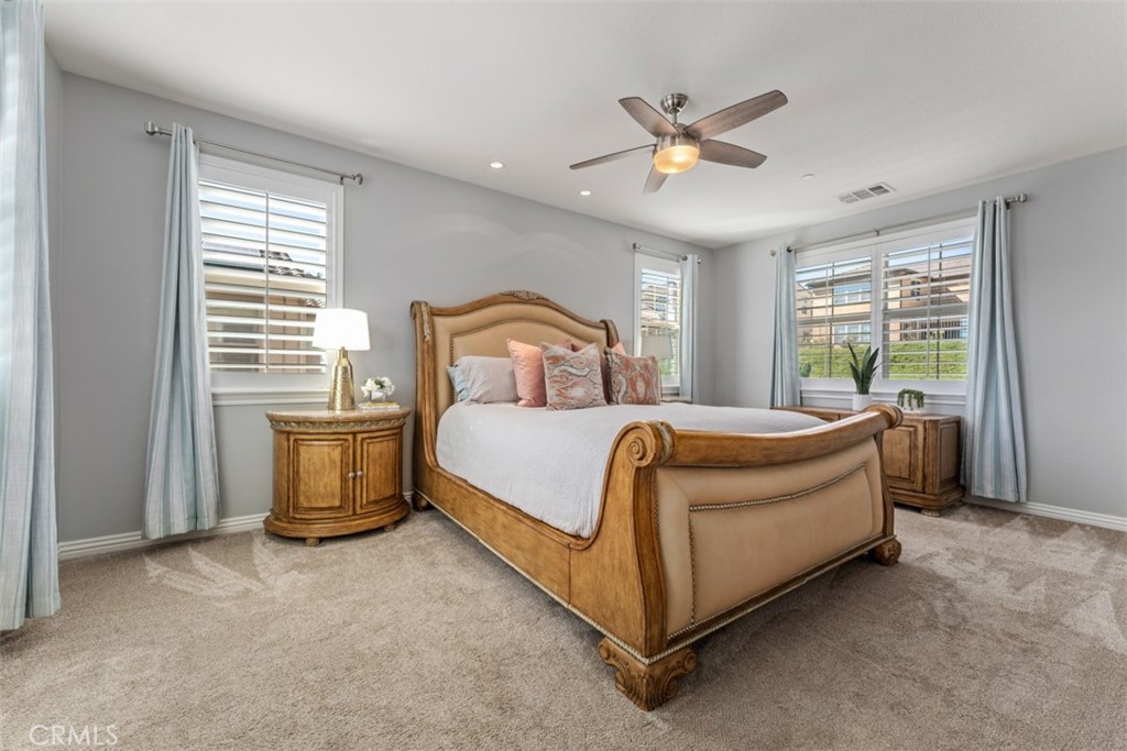 23 Vivido Street Rancho Mission Viejo, CA 92694 - Photo 17 of 44 a bed room with a bed and a ceiling fan