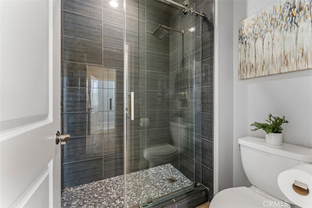 23 Vivido Street Rancho Mission Viejo, CA 92694 - Photo 20 of 44 a bathroom with a shower a toilet and a sink