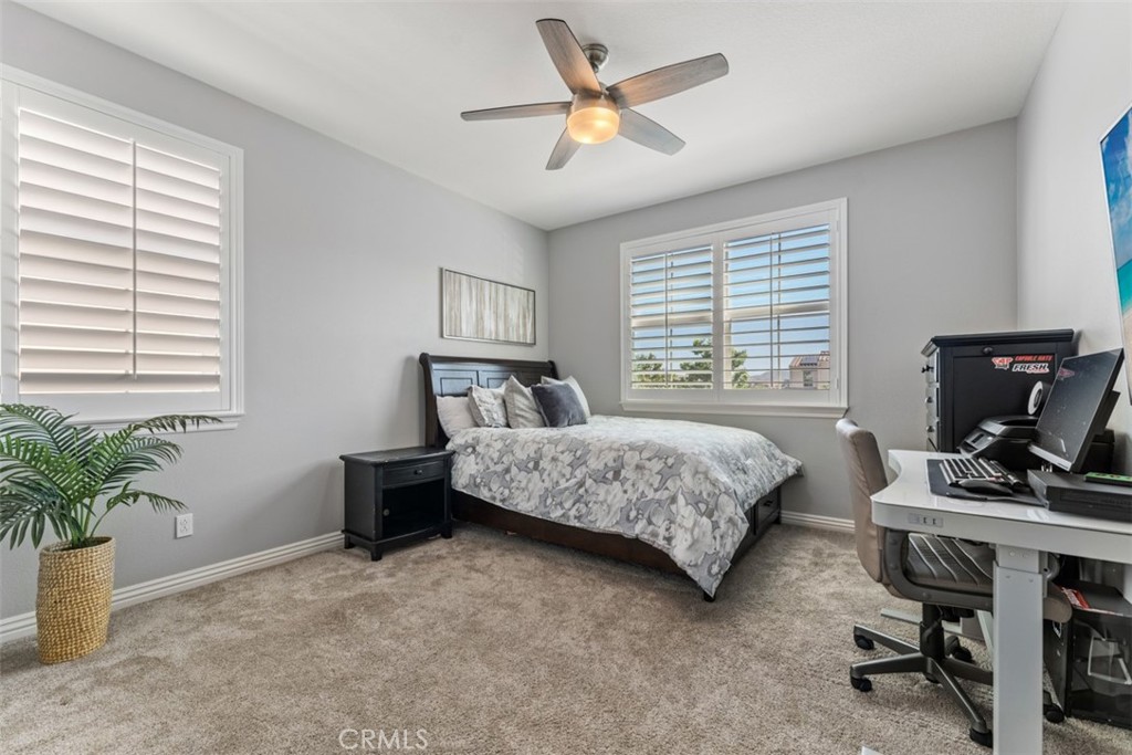 23 Vivido Street Rancho Mission Viejo, CA 92694 - Photo 23 of 44 a bedroom with a bed table chair and a window