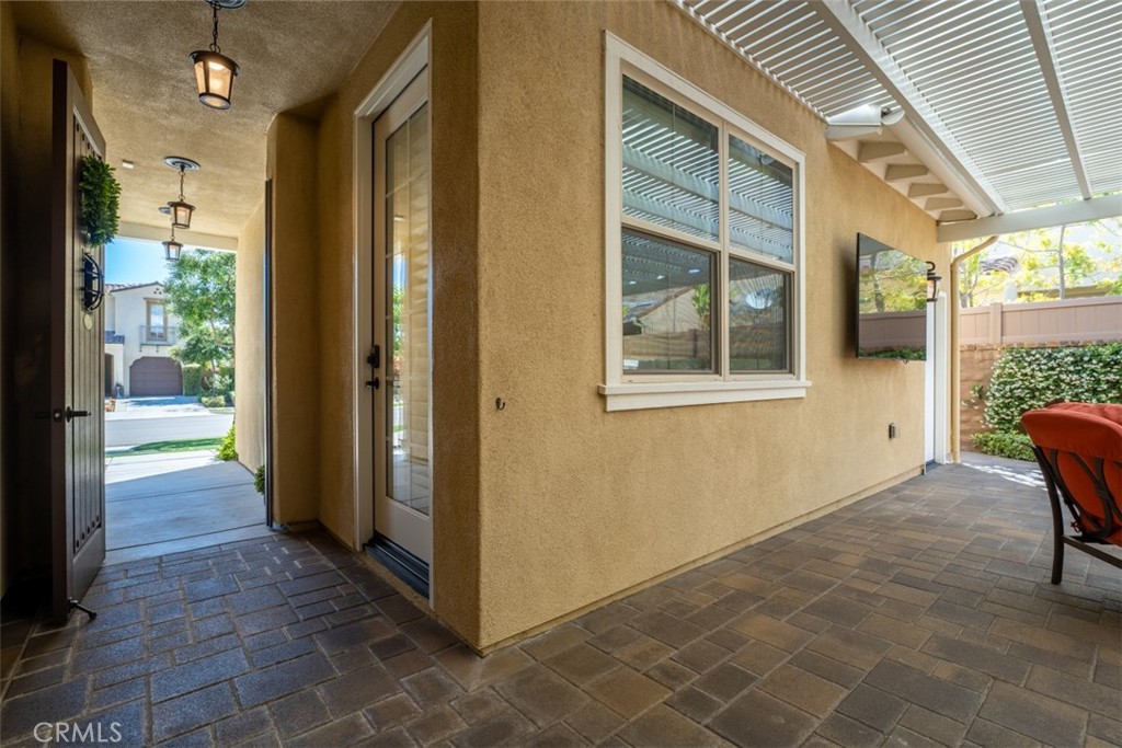 23 Vivido Street Rancho Mission Viejo, CA 92694 - Photo 24 of 44 a view of a hallway with a door and a window