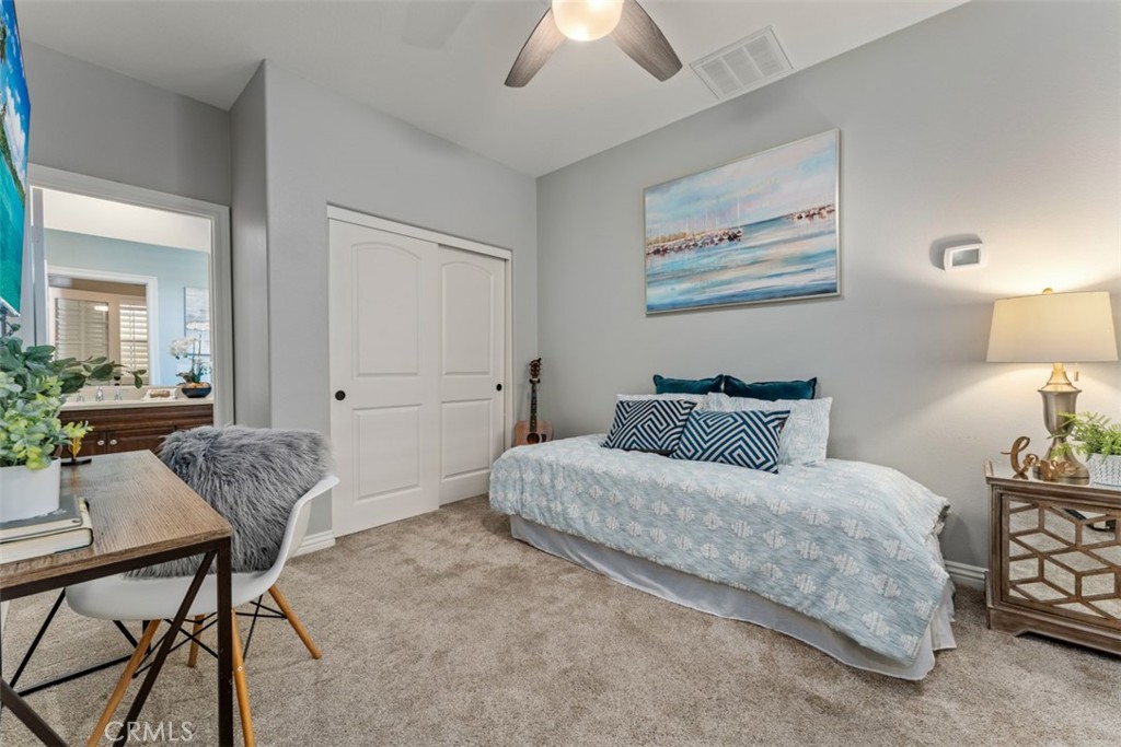 23 Vivido Street Rancho Mission Viejo, CA 92694 - Photo 26 of 44 a bedroom with a bed and a chandelier