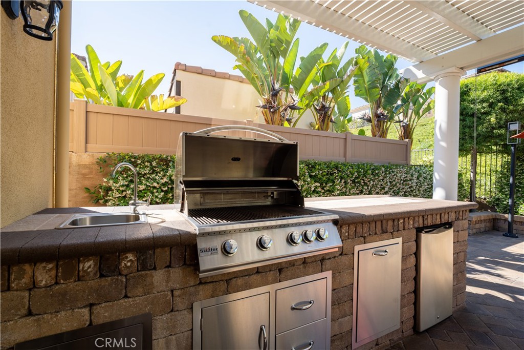 23 Vivido Street Rancho Mission Viejo, CA 92694 - Photo 34 of 44 a kitchen with a stove and a microwave