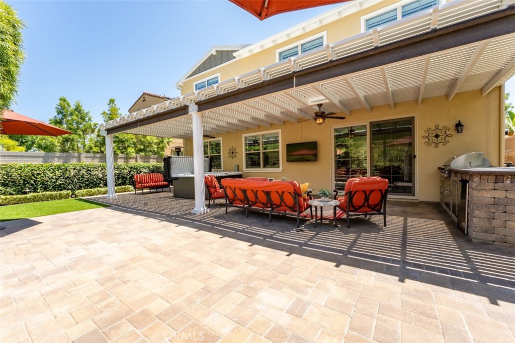 23 Vivido Street Rancho Mission Viejo, CA 92694 - Photo 36 of 44 a view of a chairs and tables in the back yard of the house