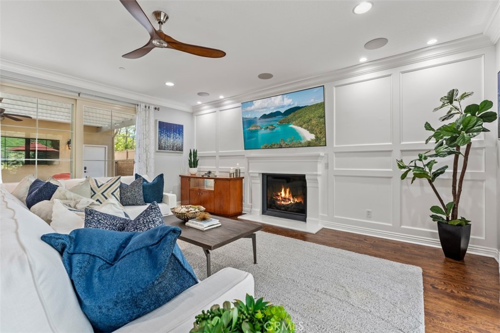 23 Vivido Street Rancho Mission Viejo, CA 92694 - Photo 8 of 44 a living room with furniture a potted plant and a fireplace
