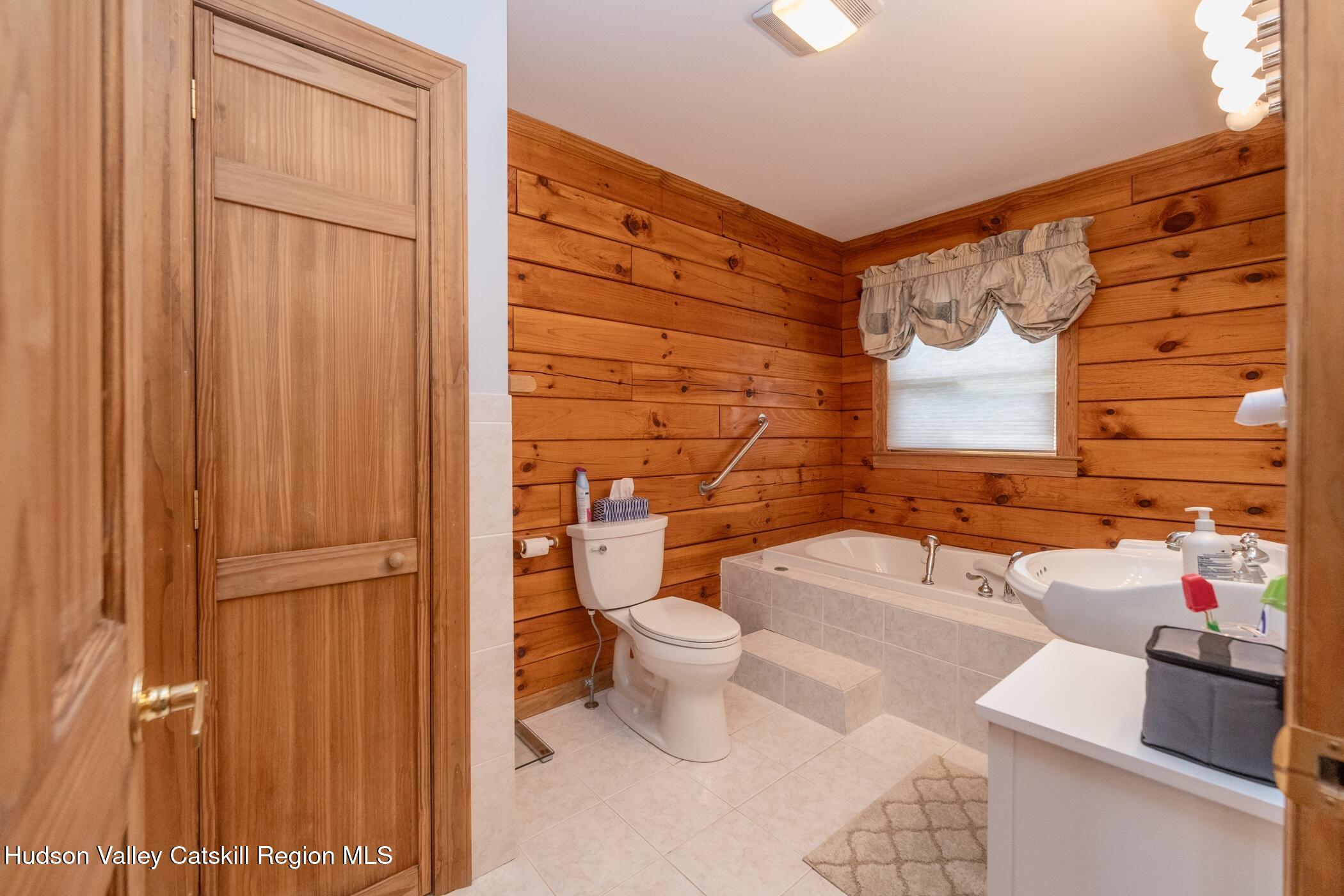 140 Stone Dock Road High Falls, NY 12440 - Photo 17 of 42 a bathroom with a toilet tub and shower