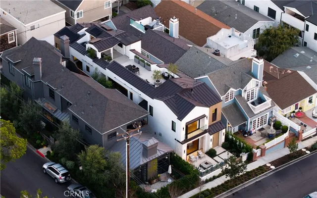 an aerial view of multi story residential apartment building with parking space