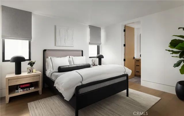 a bedroom with bed and a window