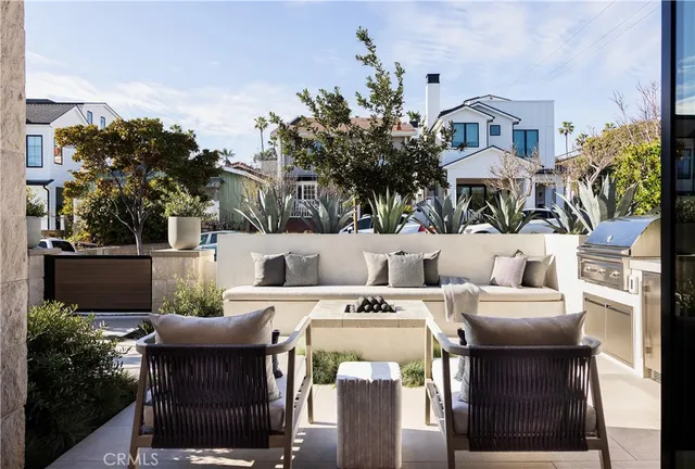 a view of a patio with table and chairs and potted plants