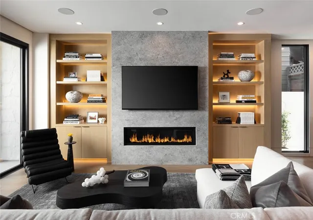 a living room with furniture and a fireplace