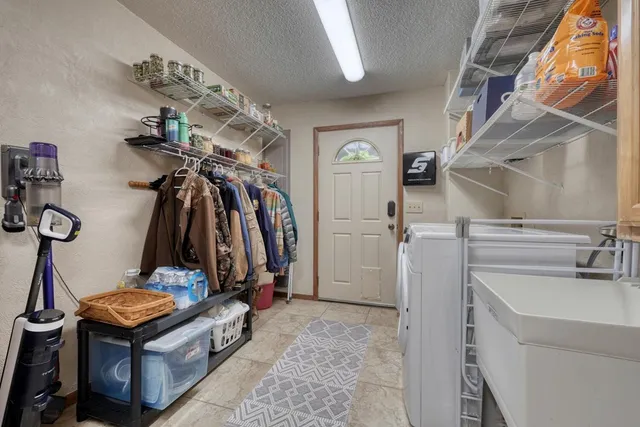 a view of livingroom with washer and dryer