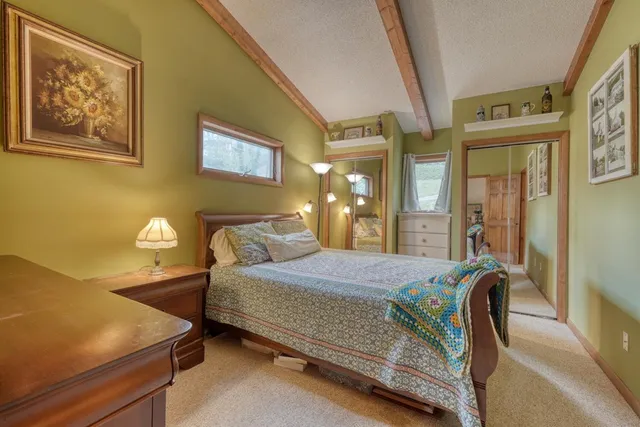 a bathroom with a sink vanity granite and a mirror