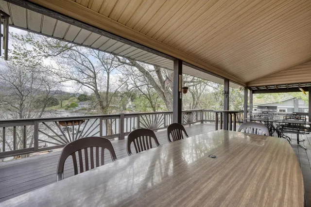 a view of a balcony with couch and wooden floor