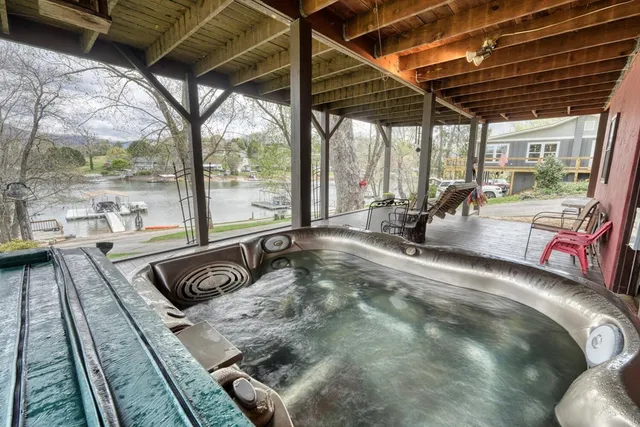 a view of a backyard with a table and chairs