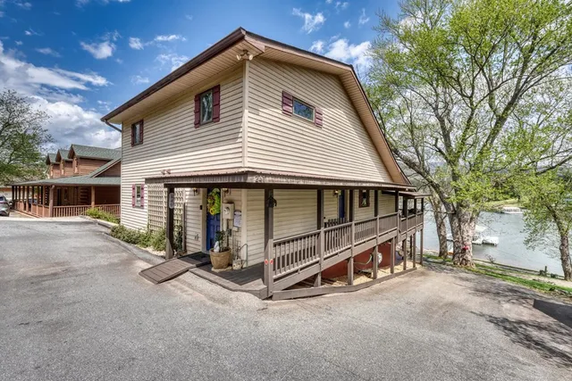 a view of balcony with wooden floor and fence
