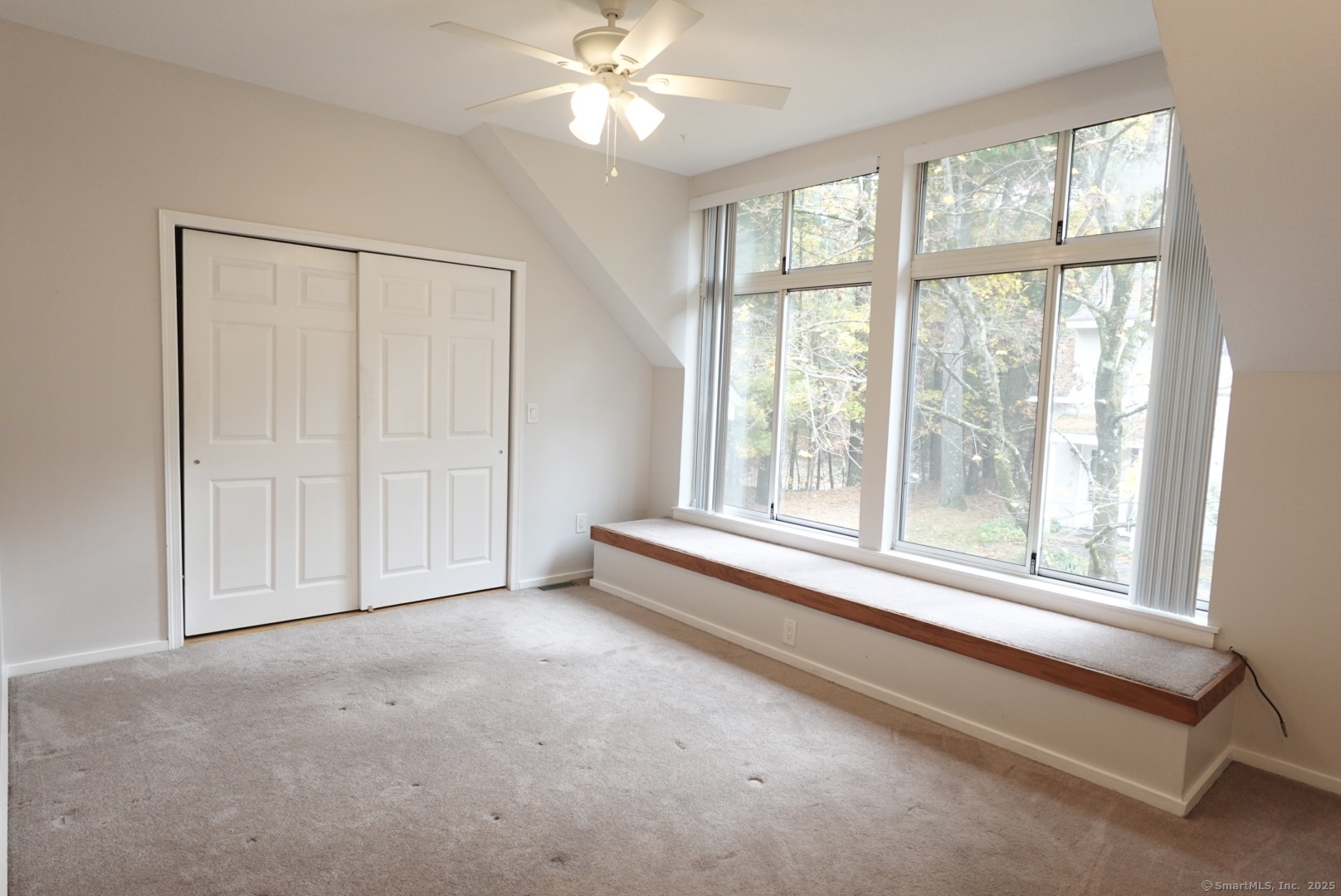 17 Pepperidge Court, Unit 17 Simsbury, CT 06070 - Photo 9 of 20 a view of an empty room with a window