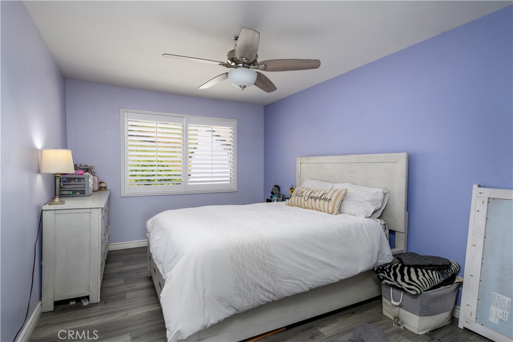 1709 Paramount Boulevard Montebello, CA 90640 - Photo 11 of 19 a bedroom with a bed and a chandelier