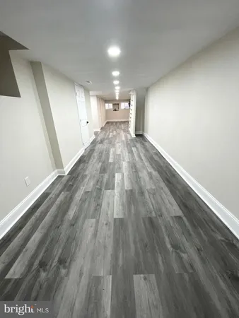 a view of gallery with wooden floor