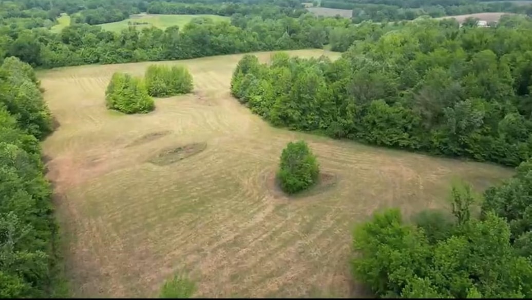 a view of a field with an outdoor space