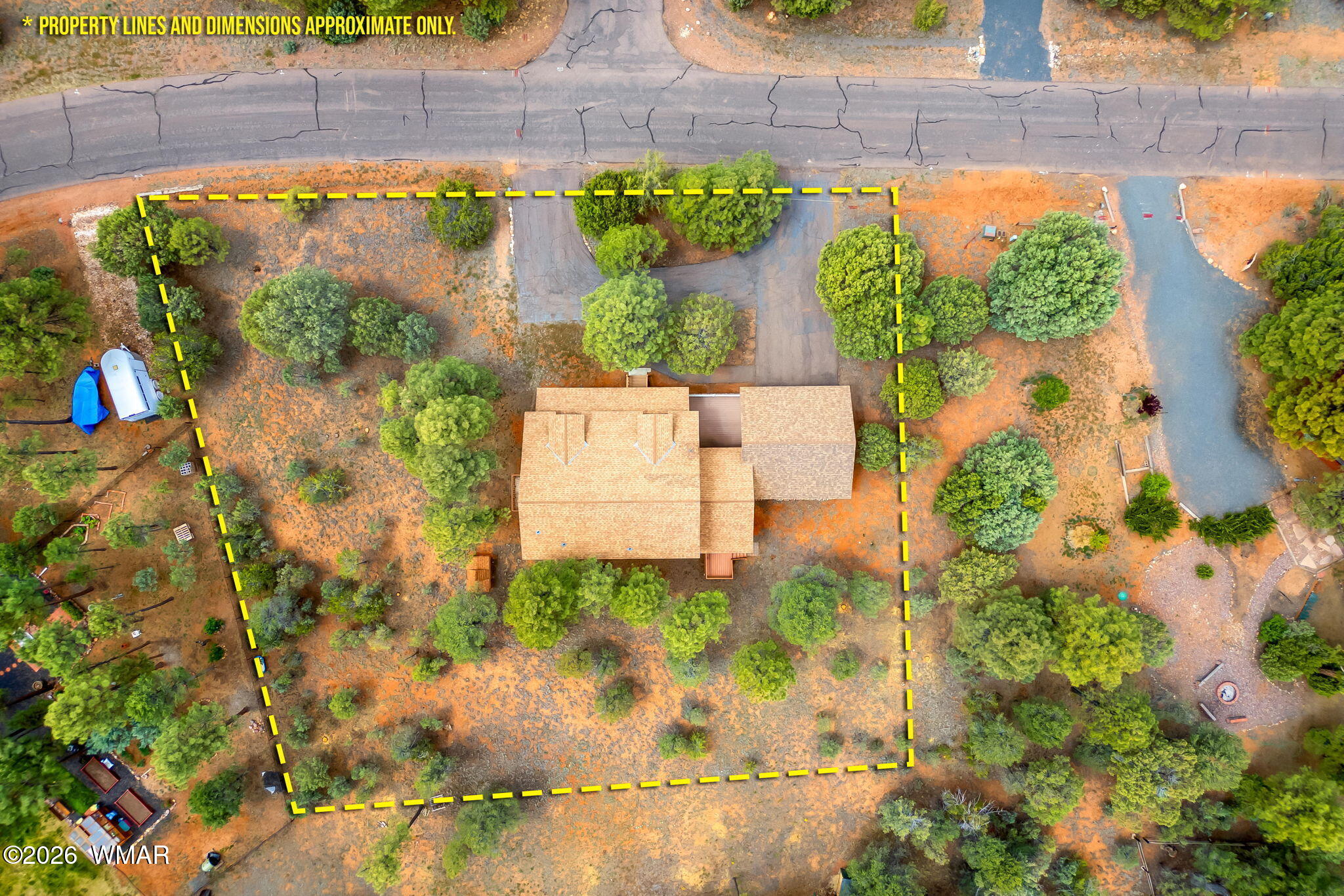 2937 Ransack Road Overgaard, AZ 85933 - Photo 31 of 34 an aerial view of a house with a yard and garden in front of it