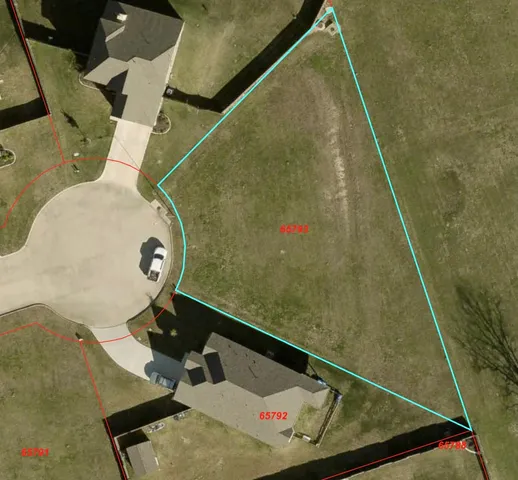 a view of a field with an ocean