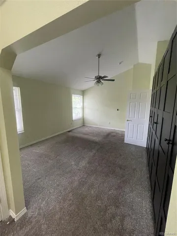 a view of empty room with windows