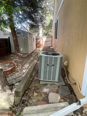 a view of a house with a tree beside of it