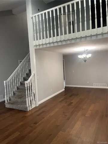 a view of entryway with wooden floor