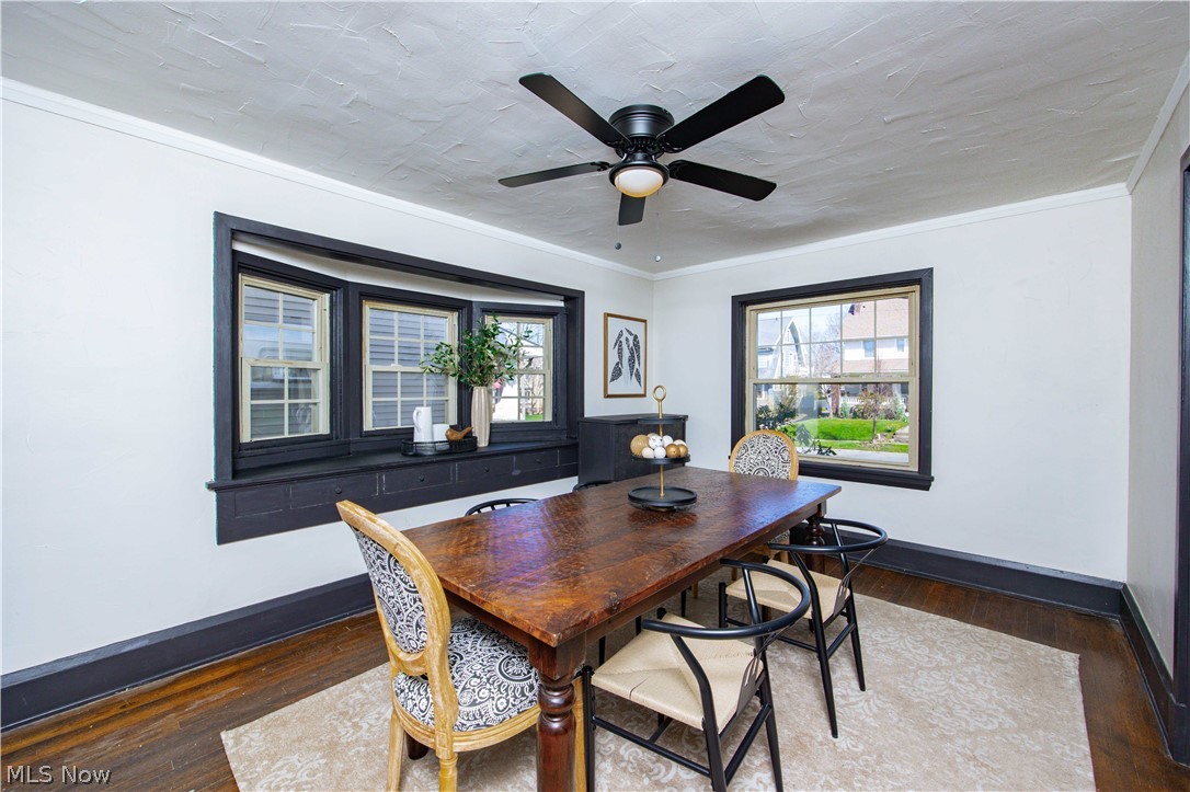 3254 Redwood Road Cleveland Heights, OH 44118 - Photo 13 of 49 Dining area featuring crown molding, ceiling fan, and dark wood-type flooring