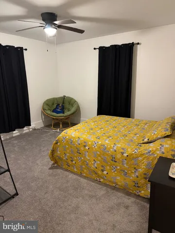 a bedroom with a bed and a closet