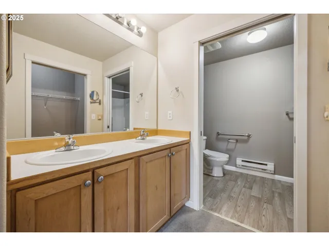 a bathroom with a granite countertop sink mirror and a