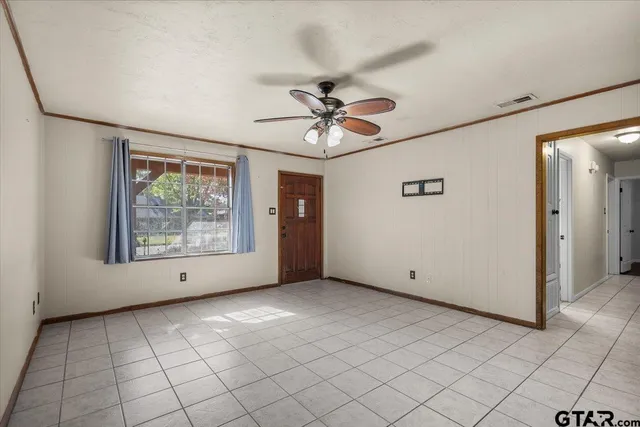 a view of an empty room with a window