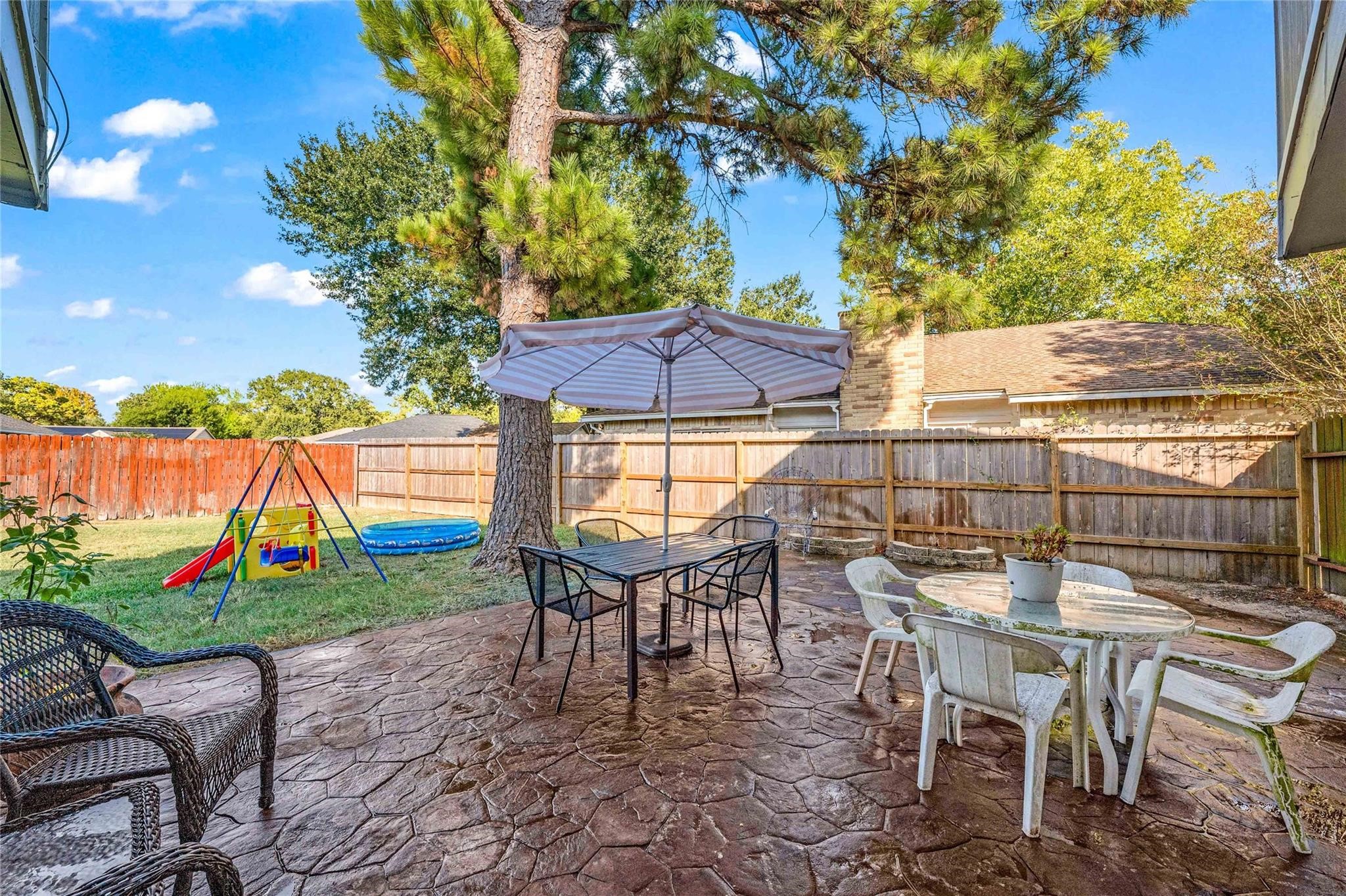 24014 Red Sky Drive Spring, TX 77373 - Photo 3 of 23 an outdoor space with furniture and umbrella