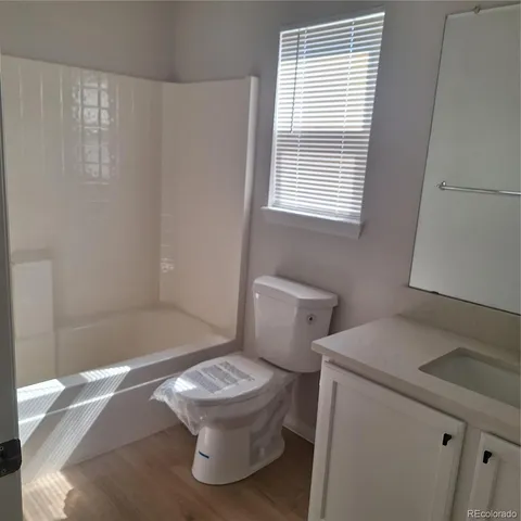 a white toilet sitting next to a bathroom sink