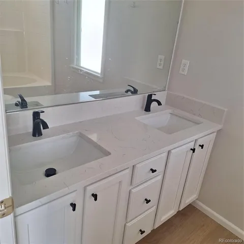 a bathroom with a sink and a window