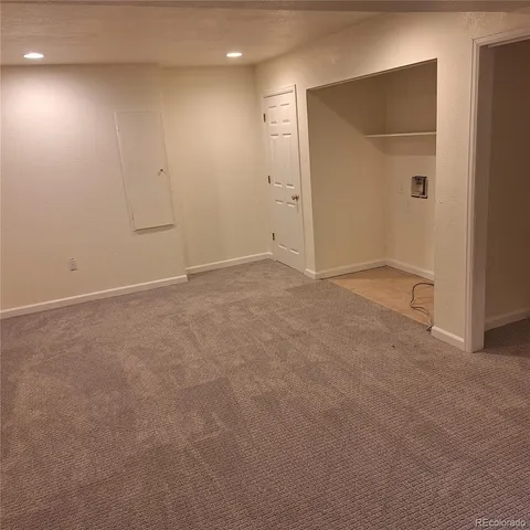 a view of an empty room with a window