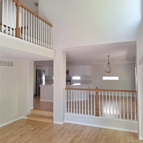 a kitchen with cabinets and stainless steel appliances