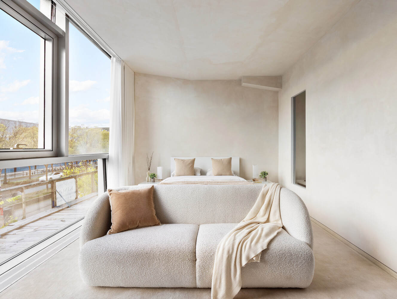 100 11th Avenue, Unit 3C Manhattan, NY 10011 - Photo 2 of 8 a living room with a large window and a couch