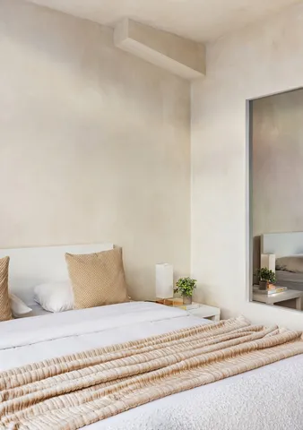 a living room with a large window and a couch